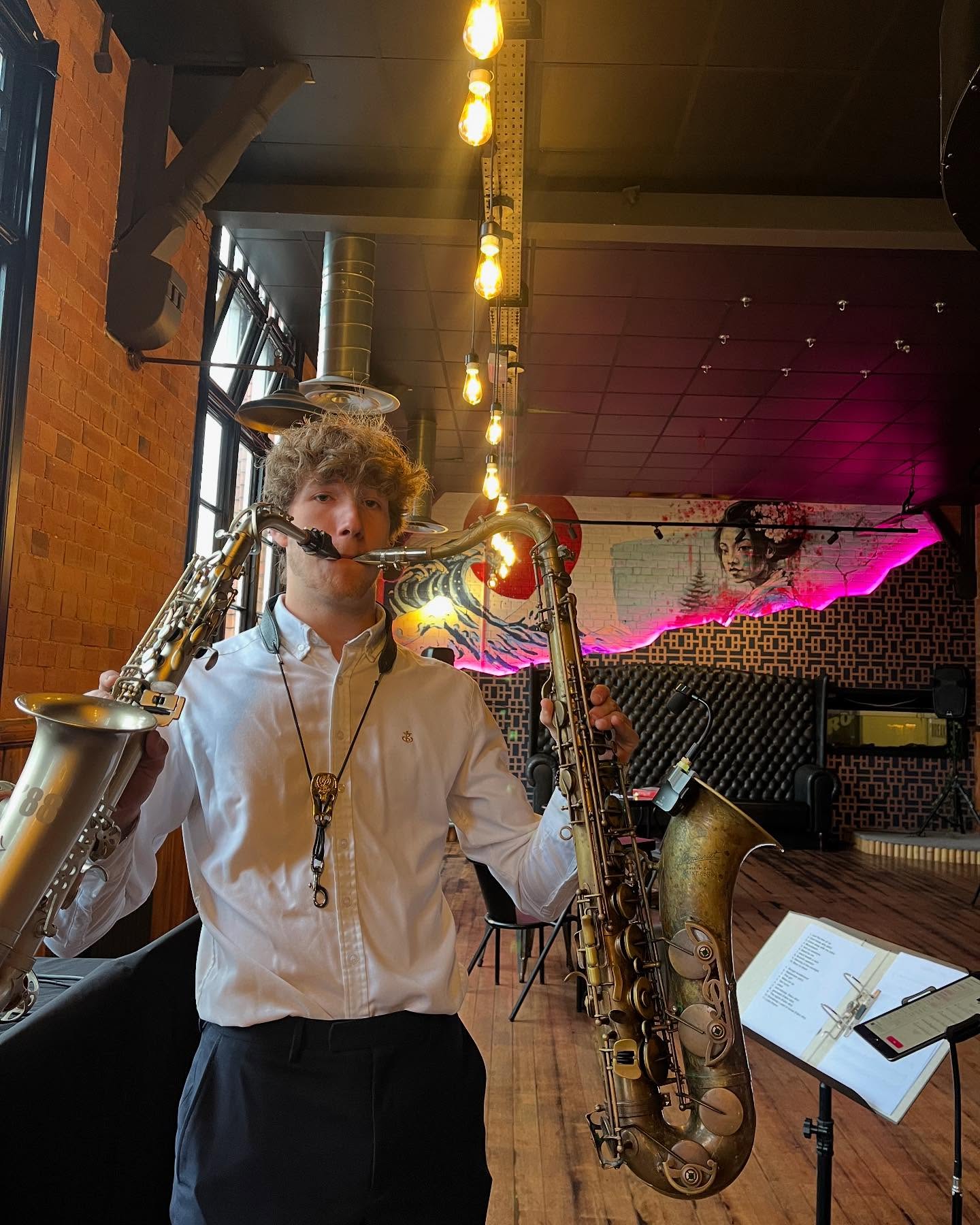 Me playing two saxophones at once during a daytime set